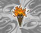 sticker of an ice cream cone with flames on the top